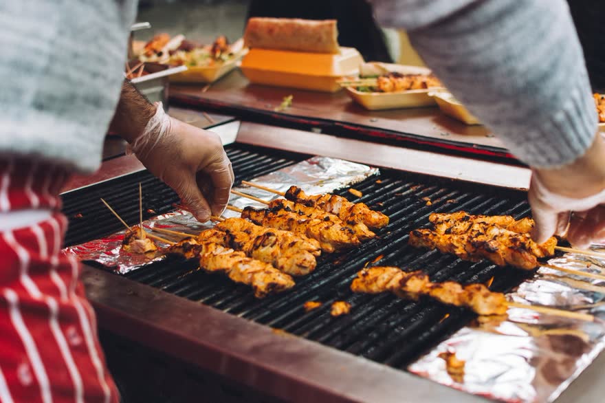 Chicken satay skewers on the charcoal grill